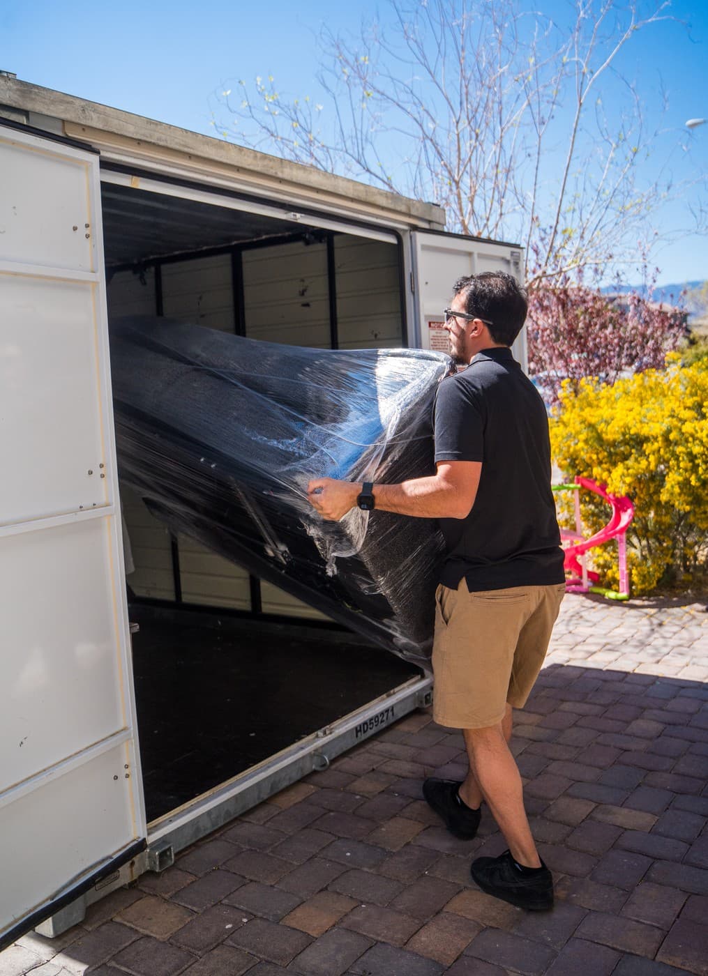 Coyotes Moving crew members carrying furniture during an Enterprise move