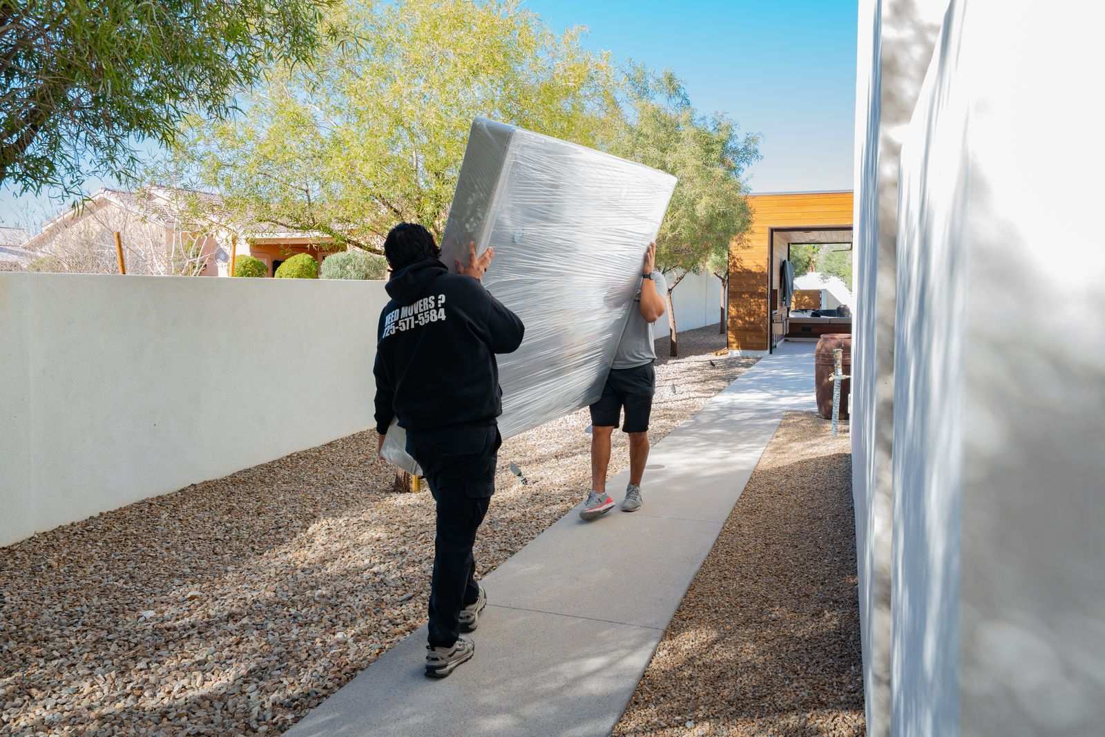 Coyotes Moving crew members assembling furniture during a Spring Valley move