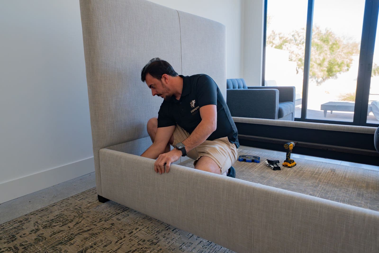 Coyotes Moving crew assembling furniture at a Las Vegas home
