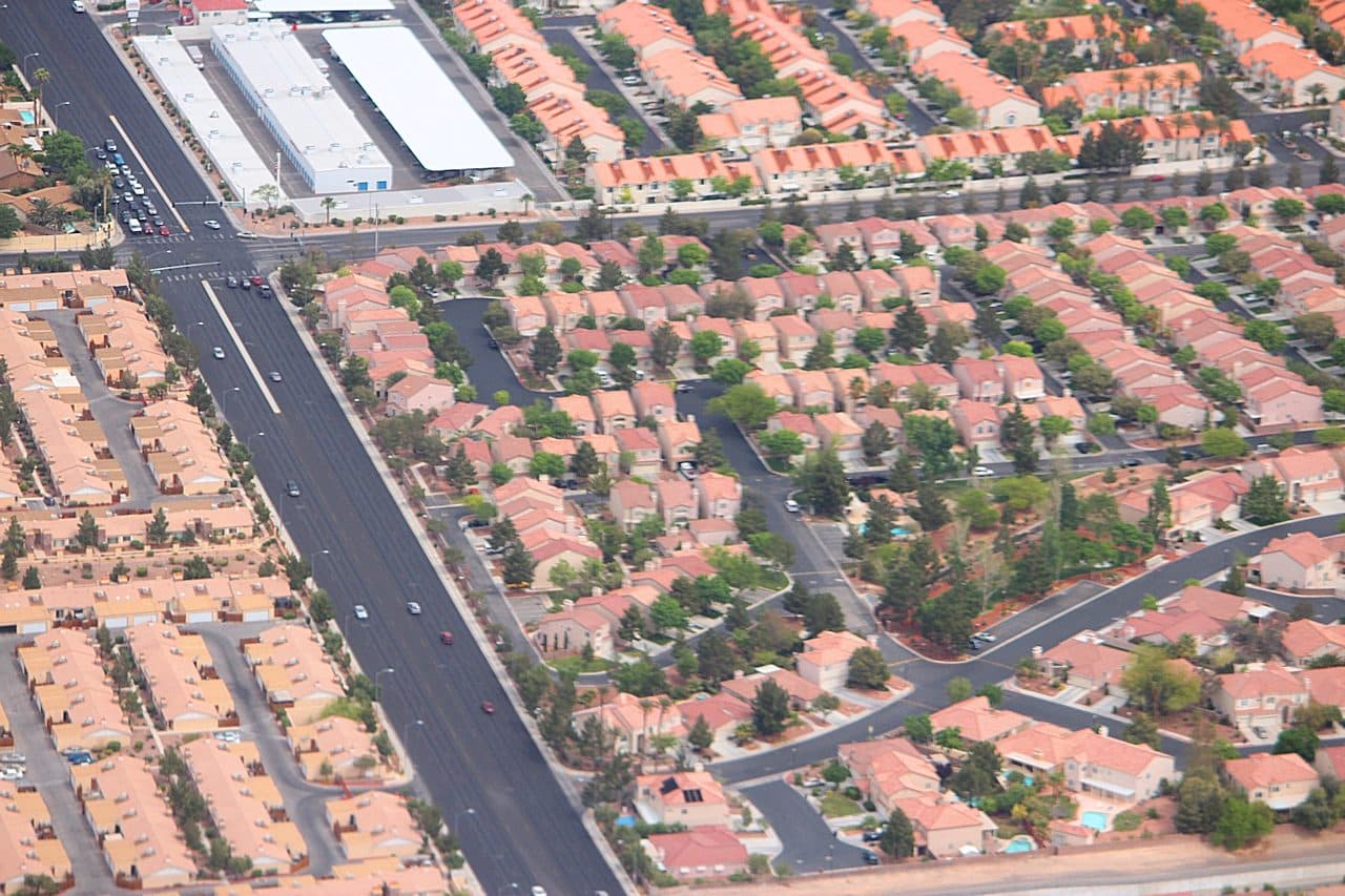 Aerial view of a Las Vegas suburban neighborhood with tree-lined streets and single-family homes